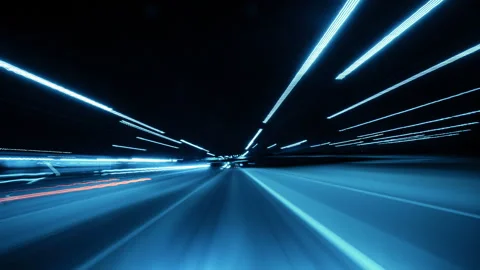Nighttime Drive Through Illuminated Road Lights With Motion Blur Effects Stock Footage 319058762