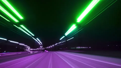 Nighttime Drive Through Illuminated Road Lights With Motion Blur Effects Stock Footage 329610864