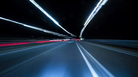 Nighttime Drive Through Illuminated Road Lights With Motion Blur Effects. Stock Footage 343630151