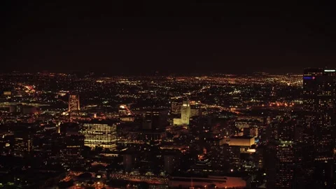 Nighttime drone flight over Los Angeles showing illuminated towers Stock Footage 344389926