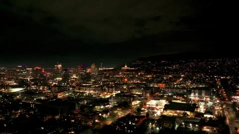 Nighttime drone shot flying over downtown Salt Lake City towards capital Stock Footage 257053408