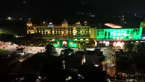 Nighttime drone shot of the Radisson Blu Hotel in Mysore next to a shopping Stock Footage 293570445