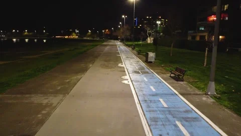 Nighttime Drone View of an Empty Blue Bike Lane in Istanbul Park, 4k Stock Footage 314306935