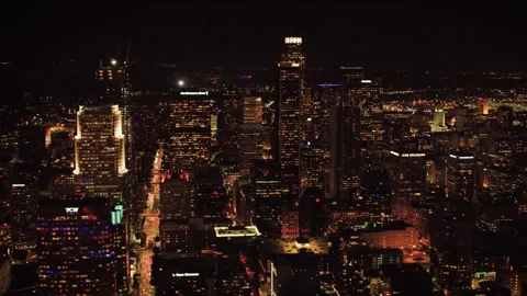 Nighttime drone view over downtown Los Angeles showcasing city lights Stock Footage 344389571