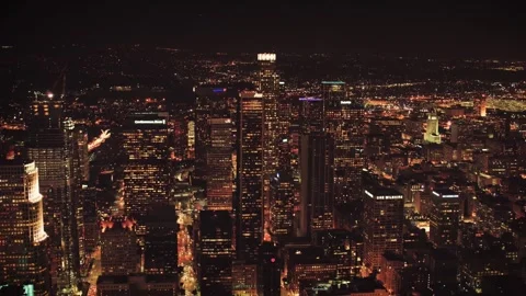 Nighttime drone view over Los Angeles displaying glowing skyscrapers Stock Footage 344389388