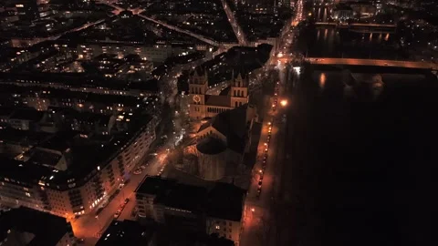 Nighttime drone view of St. Maximilian Church in Munich, featuring the Stock Footage 323295556