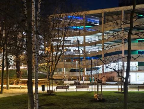 Nighttime environment showcasing multilevel parking garage with illuminatin.. Photos