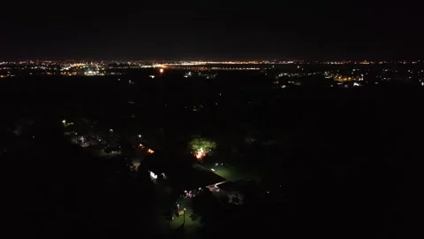 Nighttime fireworks exploding over wedding venue lights creating colorful Video stock 332525941