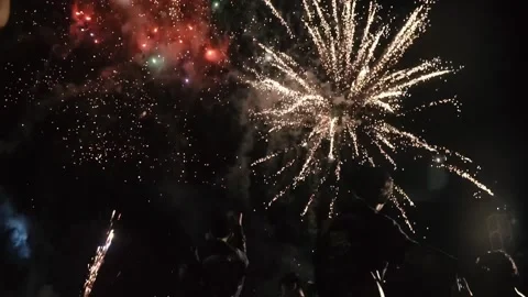 Nighttime Fireworks Spectacle Low Angle View of Jubilant Crowd in Pangandaran Stock Footage 300522478
