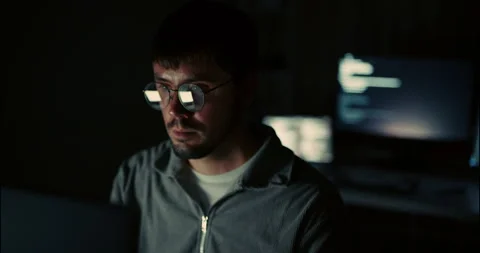 Nighttime Hacker or Programmer Working in Dark Room with Code Reflections. Video stock 306739555