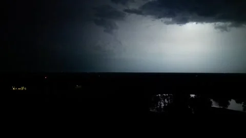 Nighttime lightning storm over a city Stock Footage 246323023