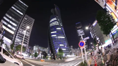Nighttime Low-Angle View of Modern Skyscrapers in a Japanese City Stock Footage 310705582
