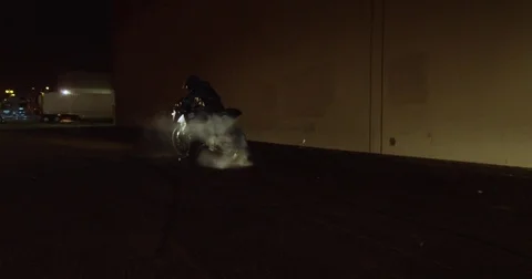 Nighttime Motorcycle Donut Trick Video stock 71787093
