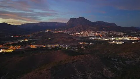 Nighttime Mountain Landscape With Lights, Distant Mountain Peaks And Stock-Fotos