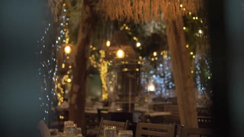 Nighttime outdoor dinner table restaurant warm inviting winter athens psyrri Video stock 327883882