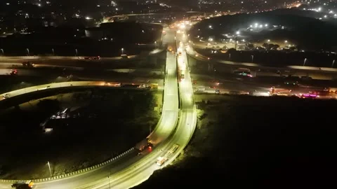Nighttime overhead drone shot of intersecting highways Stock Footage 295480518
