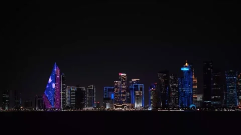 Nighttime panoramic view of the illuminated West Bay skyline in Doha, Qatar. Stock Footage 336693894
