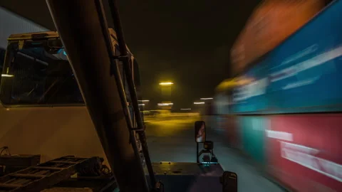 Nighttime Reach Stacker POV Operation in Container Terminal Stock Footage 341889392