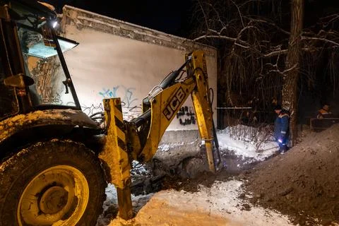 Nighttime repair work on a heating network in Kyiv during winter Stock Photos