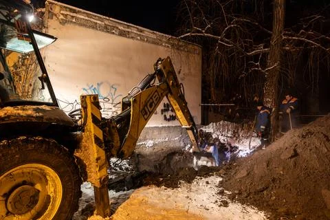 Nighttime repair work on a heating network in Kyiv during winter blackouts Stock Photos