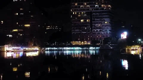 Nighttime Scene of Cairo City Lights and Boats on the Nile River Stock Footage 313247360