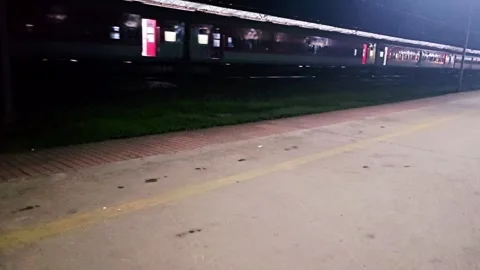Nighttime shot of a train at a station 스톡 동영상 315351291