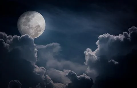 Nighttime sky with clouds, bright full moon would make a great background. Stock Photos