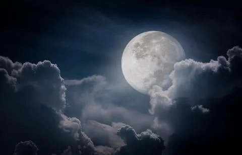 Nighttime sky with clouds, bright full moon would make a great background. Stock Photos