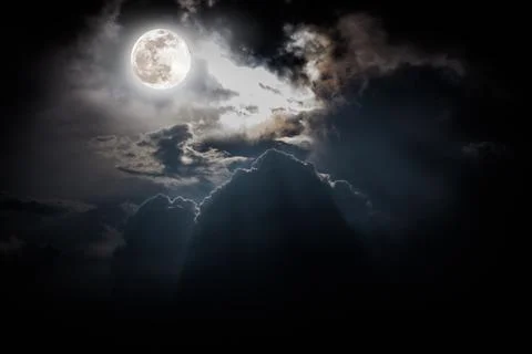 Nighttime sky with clouds, bright full moon would make a great background. Stock Photos