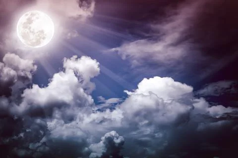 Nighttime sky with clouds, bright full moon would make a great background. Stock Photos