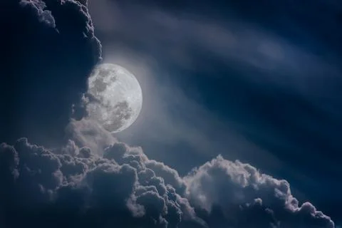 Nighttime sky with clouds, bright full moon would make a great background. Stock Photos