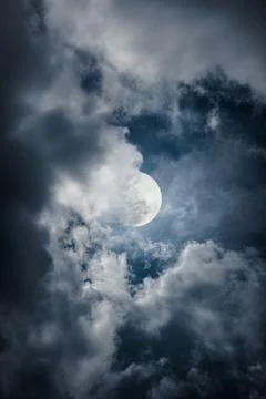 Nighttime sky with clouds, bright moon would make a great background. Stock Photos