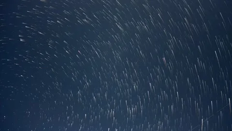 Nighttime time lapse of the stars moving through a dark blue sky.  Stock Footage 275533271
