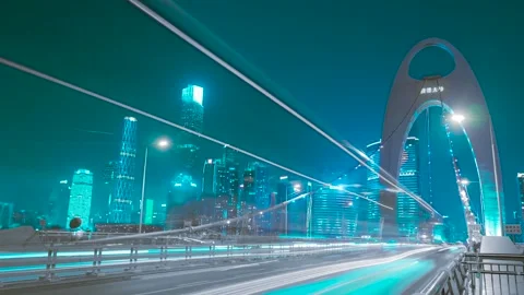Nighttime traffic light trails on Liede Bridge in Guangzhou city skyline Stock Footage 342264695