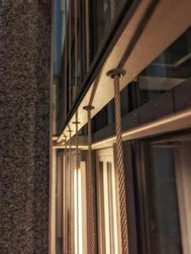 Nighttime Urban Setting Featuring Luminous Reflections On Contemporary Metal And 스톡 사진