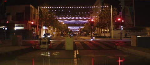 Nighttime Urban Street with String Lights, 1.5x Anamorphic Stock Footage 299169208