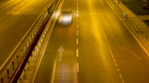 Nighttime Velocity: Translucent Trails of Swift Cars on the Highway Stock Footage 261235353