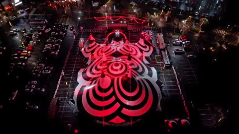 Nighttime video showing a black-and-white "circus of terror" tent with red Stock Footage 345802935