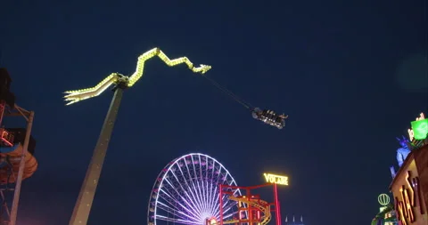 Nighttime view of adrenalin-rush rides in the Wurstelprater, Vienna, Austria Stock Footage 252022634