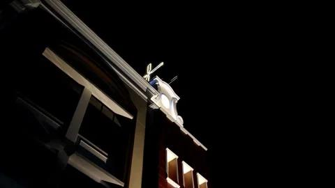 Nighttime View of Building With Unique Architectural Features and Light Accents Stock Footage 305370452