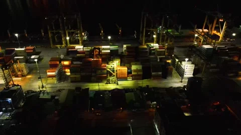 Nighttime view of a busy shipping port with colorful containers Stock-Footage 330278564