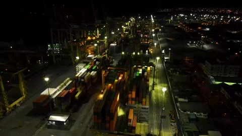 Nighttime view of cargo containers illuminated by lights Stock-Footage 330278604