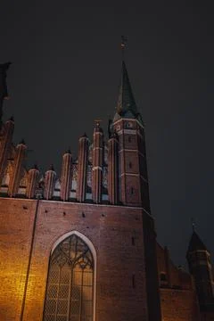Nighttime View of a Gothic Style Brick Building in Gdansk, Poland Stock Photos