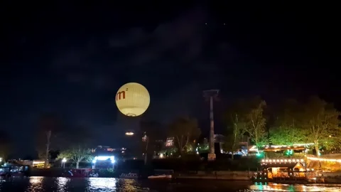 Nighttime View of Illuminated Tbilisi Riverfront with Large Lantern Balloon Stock-Footage 339244433