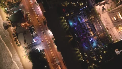 Nighttime view of lively beachfront dining and entertainment scene South Florida Video stock 297928656