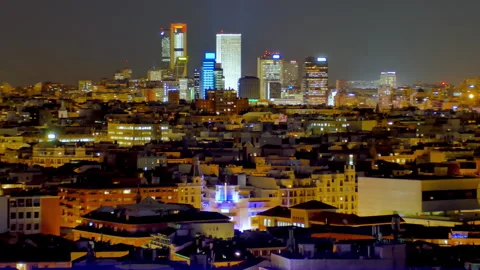 Nighttime view of Madrid’s skyline, showcasing brightly lit skyscrapers Stock Footage 285386124