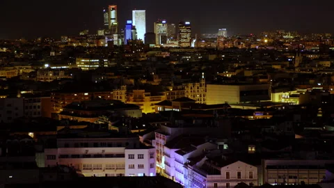 Nighttime view of Madrid’s skyline, showcasing brightly lit skyscrapers Stock Footage 285496447