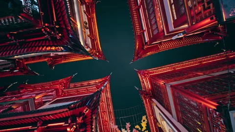 Nighttime View of Red-Lit Traditional Rooftops Forming a Cross Pattern Stock Footage 336679571