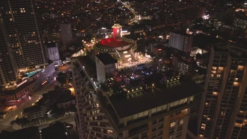 Nighttime view of a vibrant rooftop party  urban setting with city lights below Video stock 297928517