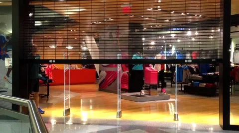 Nika store closing down at night inside metropolis shopping mall. Stock Footage 45893751